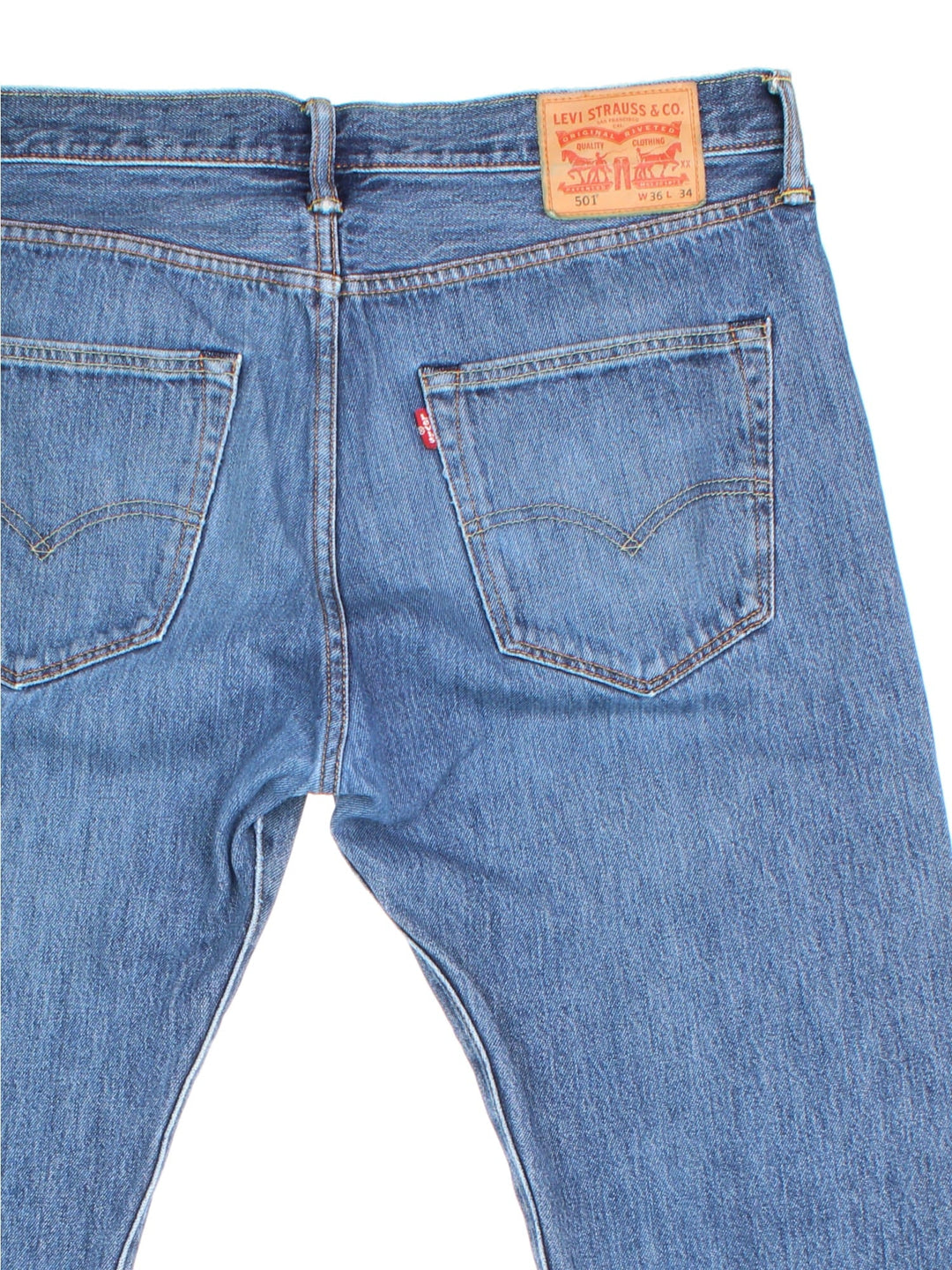 Levi Strauss 501 jeans in blue colourway with button up fly, straight leg and leather logo patch on the back.