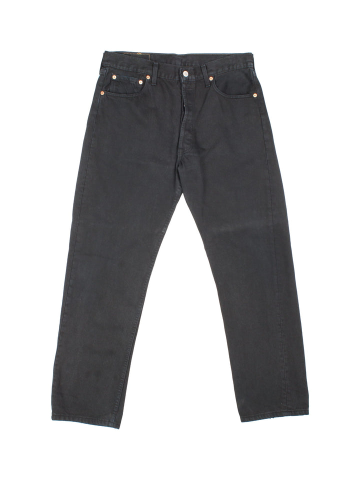 Levi Strauss 501 jeans in black colourway with multiple pockets and the logo embroidered on the back.