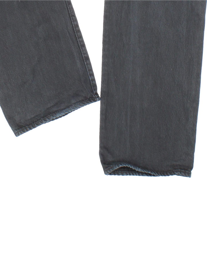 Levi Strauss jeans in black colourway with multiple pockets and the logo embroidered on the back.