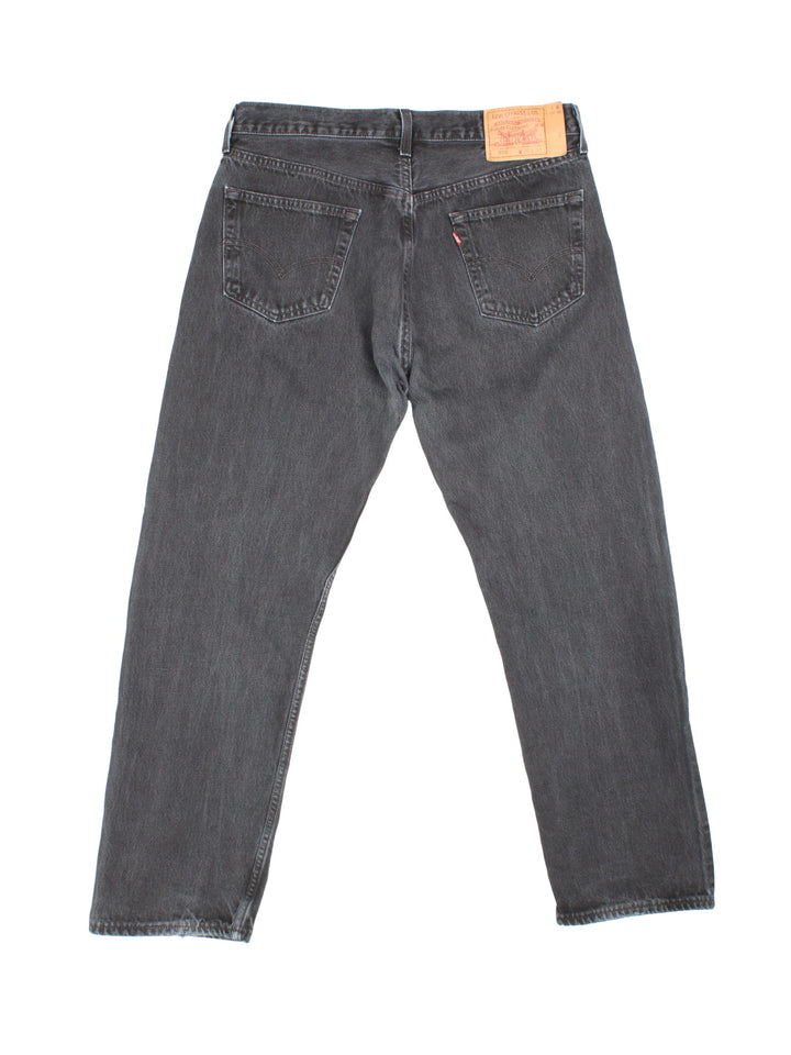 Levi Strauss jeans in black colourway with multiple pockets and the logo embroidered on the back.