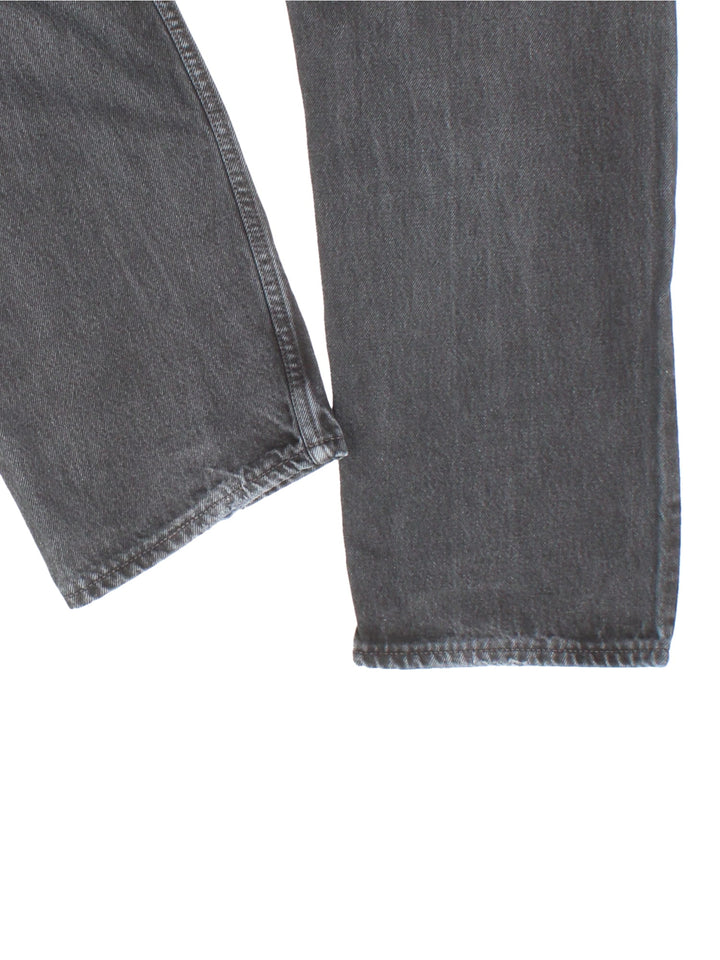 Levi Strauss jeans in black colourway with multiple pockets and the logo embroidered on the back.