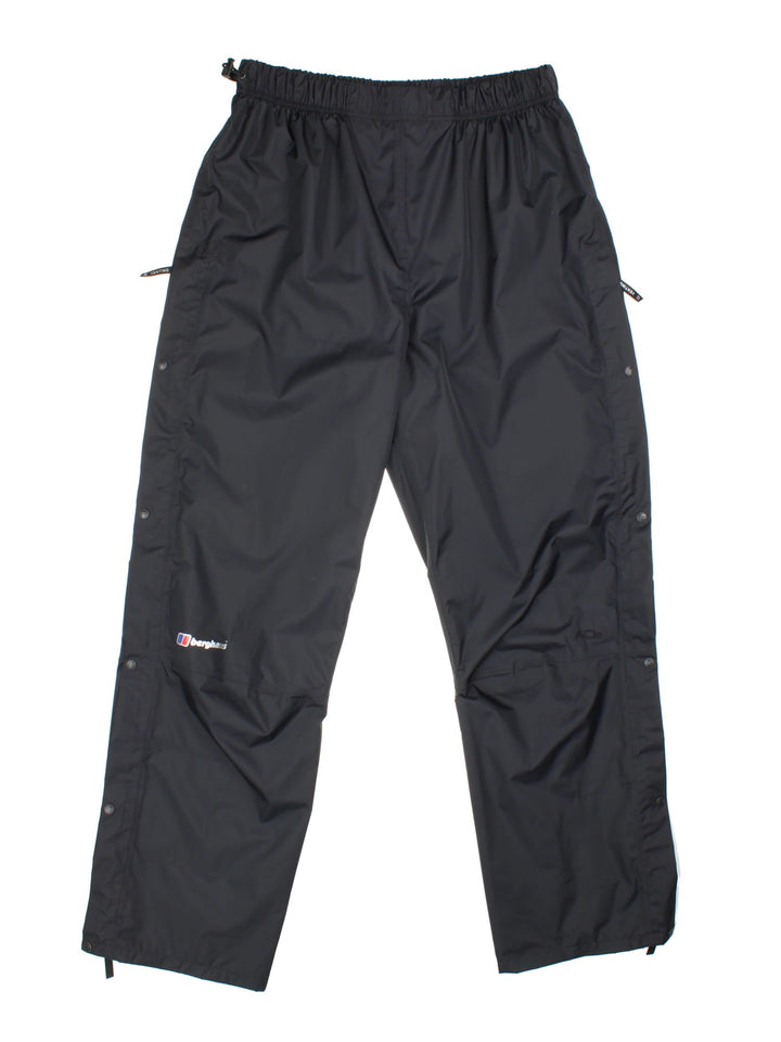 Berghaus Hydroshell Vented Trousers black colourway with popper vents, zip pockets and logo on right leg.