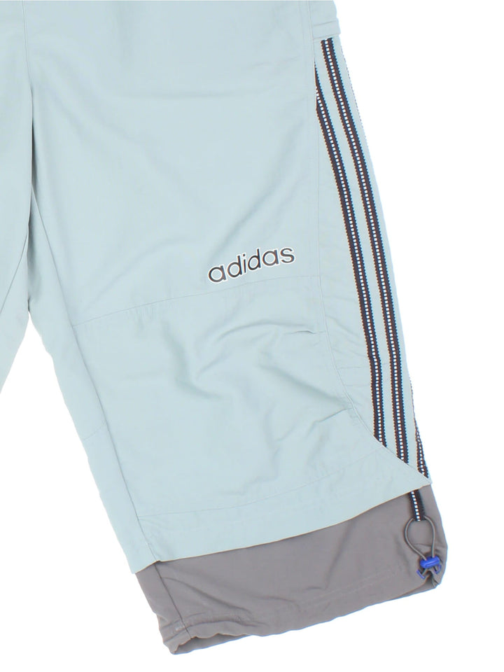 Adidas Capri Sport Trousers grey colourway with 3/4 length leg, popper pockets and logo on right leg/back pocket.