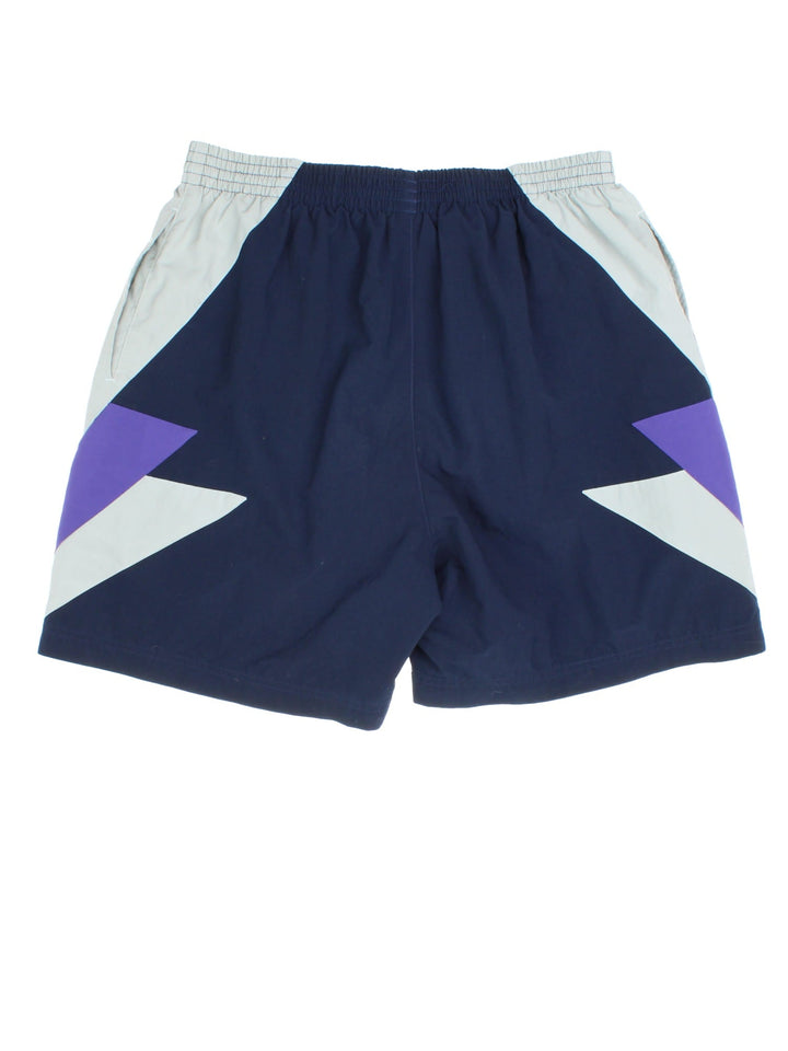 Adidas Sport Shorts in a blue colourway elasticated waist, side pockets and logo on right leg.