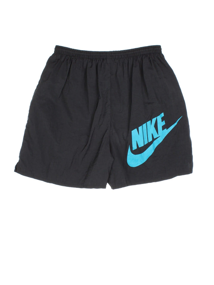 Nike Sport Shorts in a black colourway elasticated waist, side pockets, and has the logo branding on the front and back.