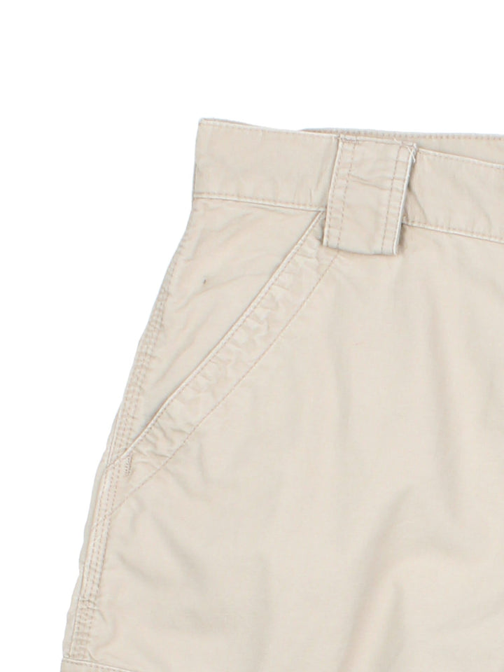 Vintage Carhartt cargo shorts in tan colourway, with side pockets and branded leather patch on back pocket.