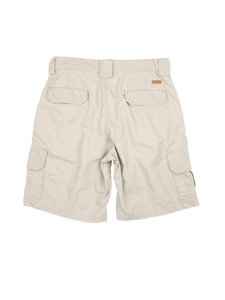 Vintage Carhartt cargo shorts in tan colourway, with side pockets and branded leather patch on back pocket.