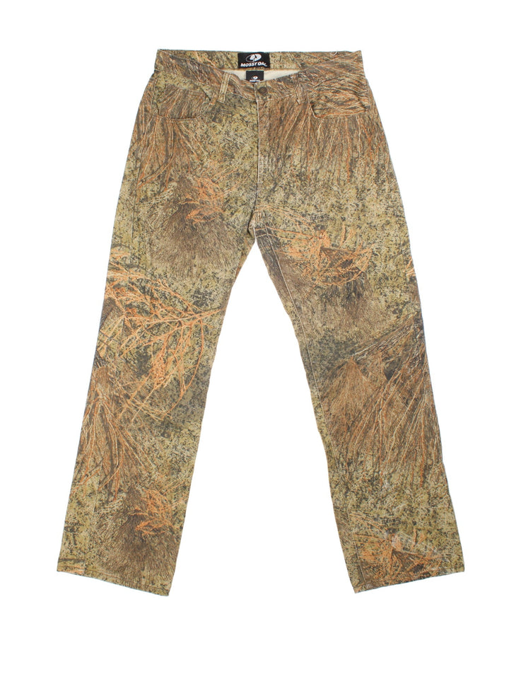 Vintage Mossy Oak Camo Jeans in green and brown patterned colourway with multiple pockets.