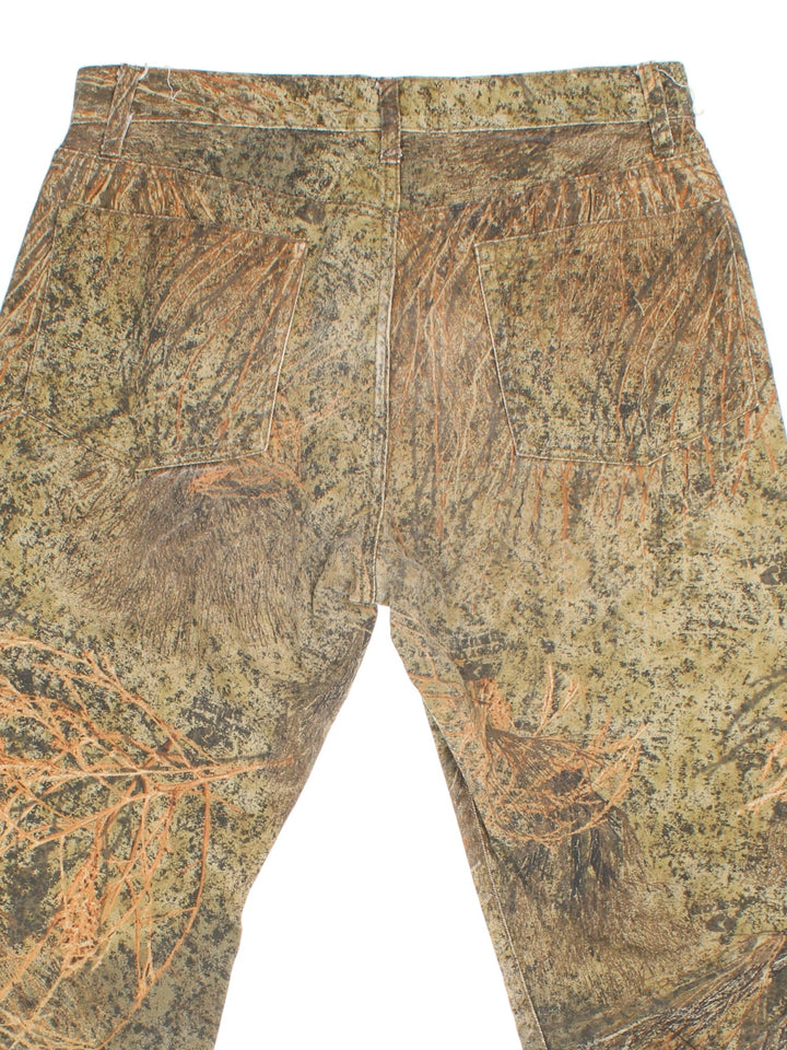 Vintage Mossy Oak Camo Jeans in green and brown patterned colourway with multiple pockets.