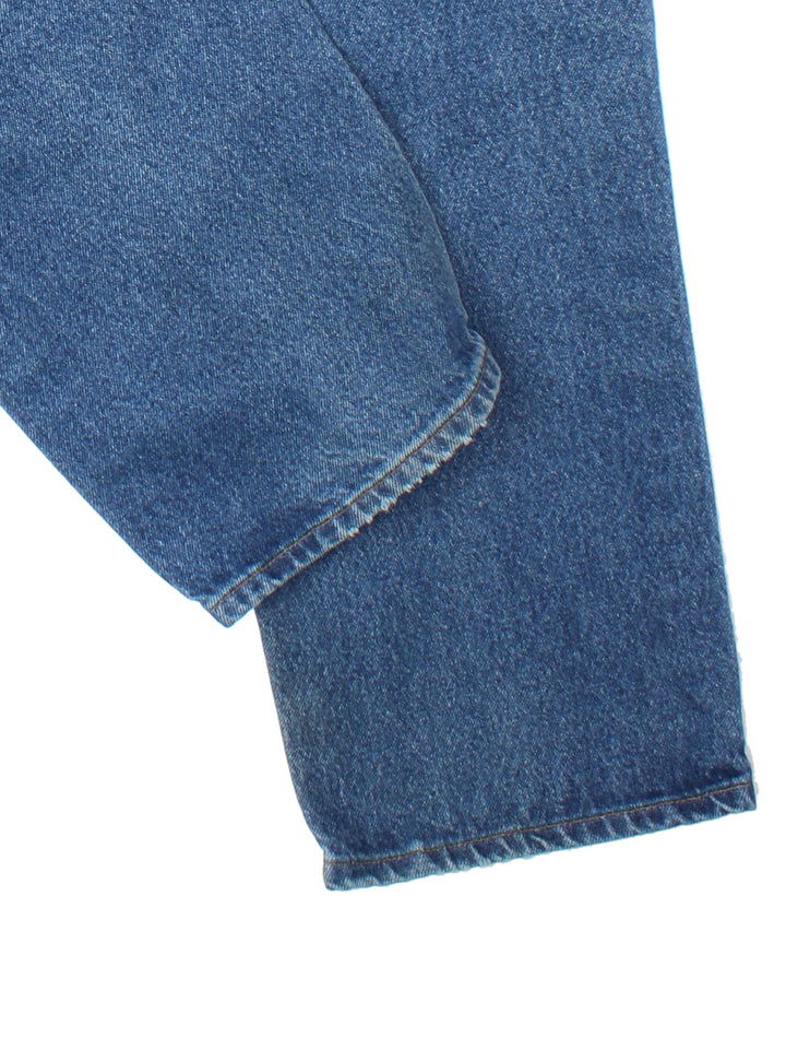 Carhartt Jeans in blue colourway with multiple pockets and the logo embroidered on the back.