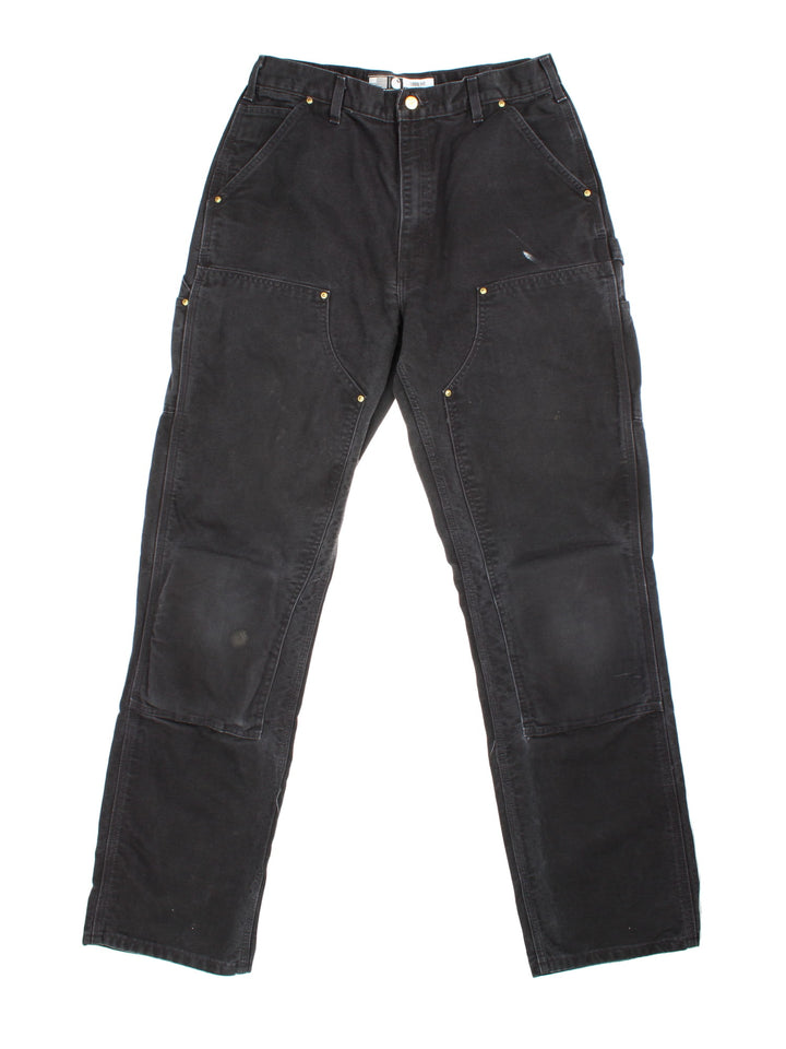 Carhartt Double Knee Jeans in black colourway with multiple pockets and the logo embroidered on the back.