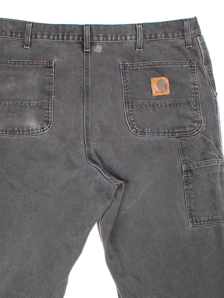 Carhartt Carpenter Jeans in faded grey colourway with multiple pockets and the logo embroidered on the back.