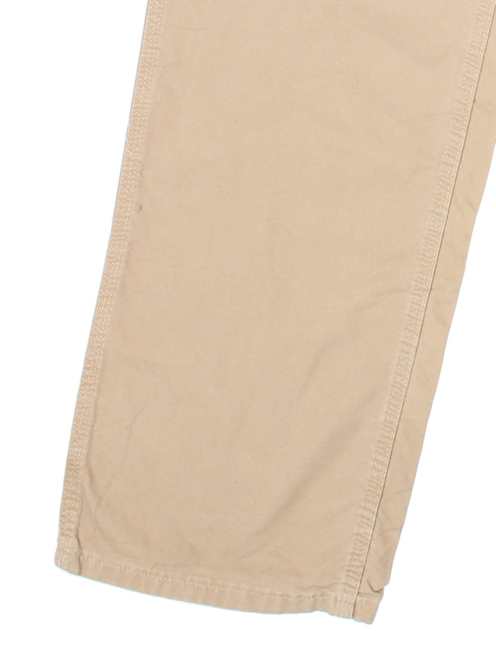 Carhartt Carpenter Trousers in tan colourway with multiple pockets and the logo embroidered on the back.