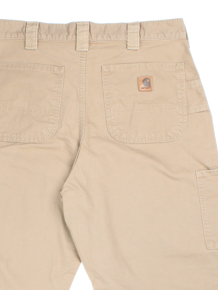 Carhartt Carpenter Trousers in tan colourway with multiple pockets and the logo embroidered on the back.