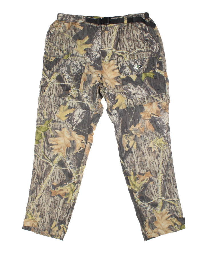 Vintage Real Tree Camo Trousers in green colourway with multiple pockets and zip off leg function.