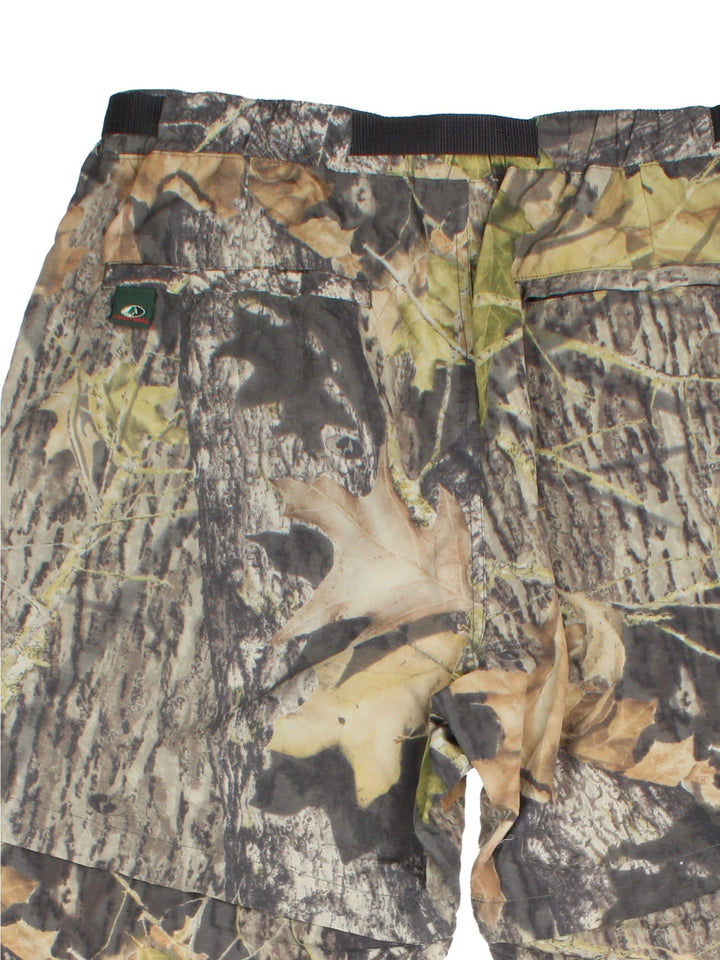 Vintage Real Tree Camo Trousers in green colourway with multiple pockets and zip off leg function.