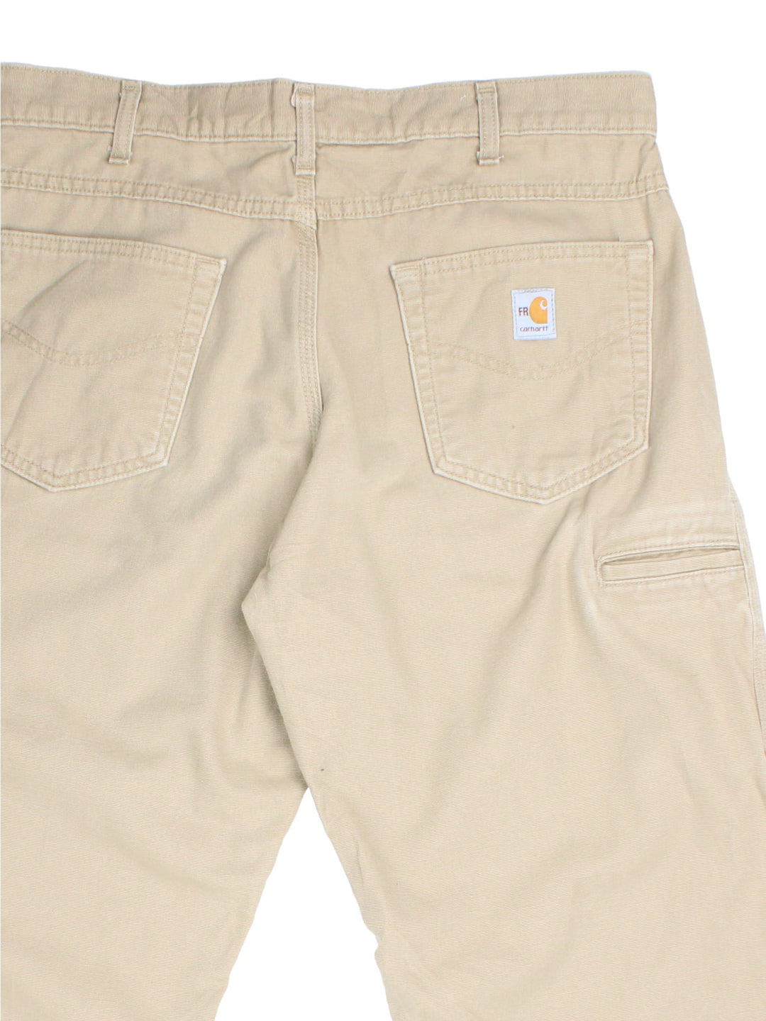 Carhartt Trousers in tan colourway. Zip fly fastening with multiple pockets and embroidered patch branding.