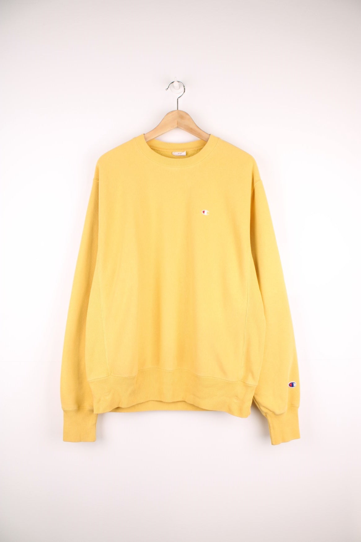 Champion Reverse Weave Sweatshirt in a yellow colourway with the logo embroidered on the chest and left sleeve. 