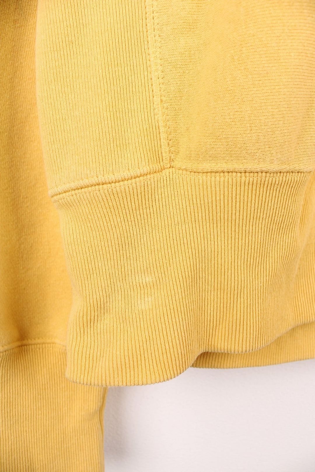 Champion Reverse Weave Sweatshirt in a yellow colourway with the logo embroidered on the chest and left sleeve. 