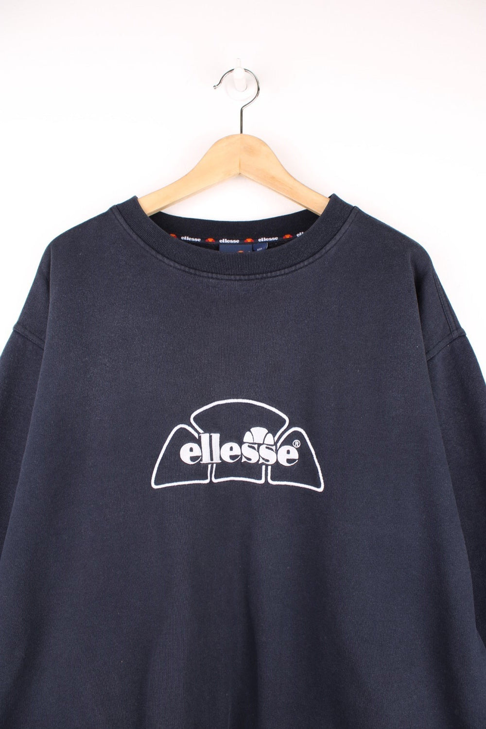 Ellesse Sweatshirt in a black colourway with the spell out logo embroidered in white across the front. 