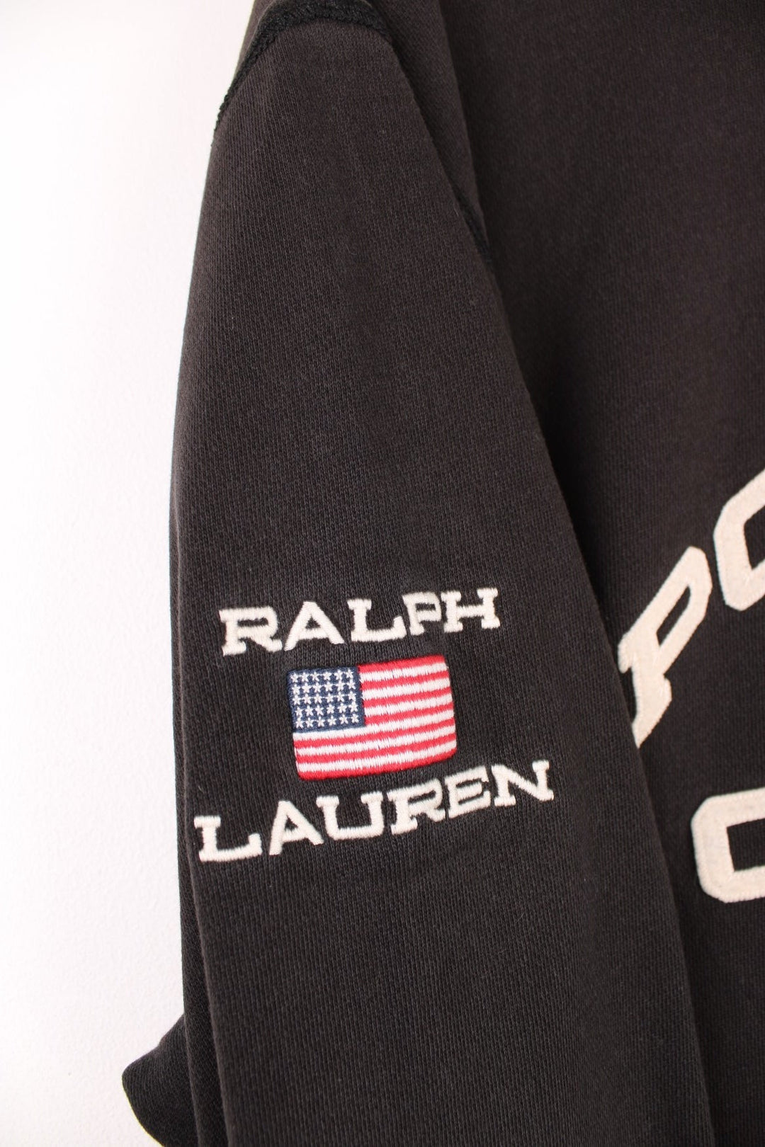 Ralph Lauren Polo Jeans Company Sweatshirt in a black colourway with the spell out logo embroidered across the front and on the right sleeve. 