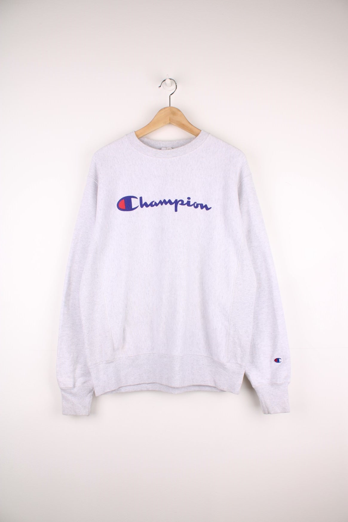 Champion Reverse Weave Sweatshirt in a grey colourway with the spell out logo printed across the front.