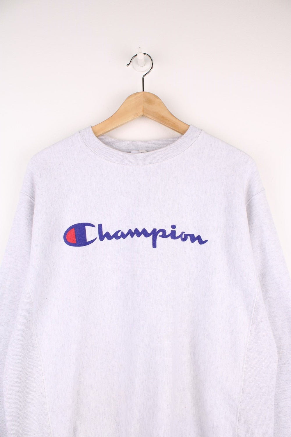 Champion Reverse Weave Sweatshirt in a grey colourway with the spell out logo printed across the front.