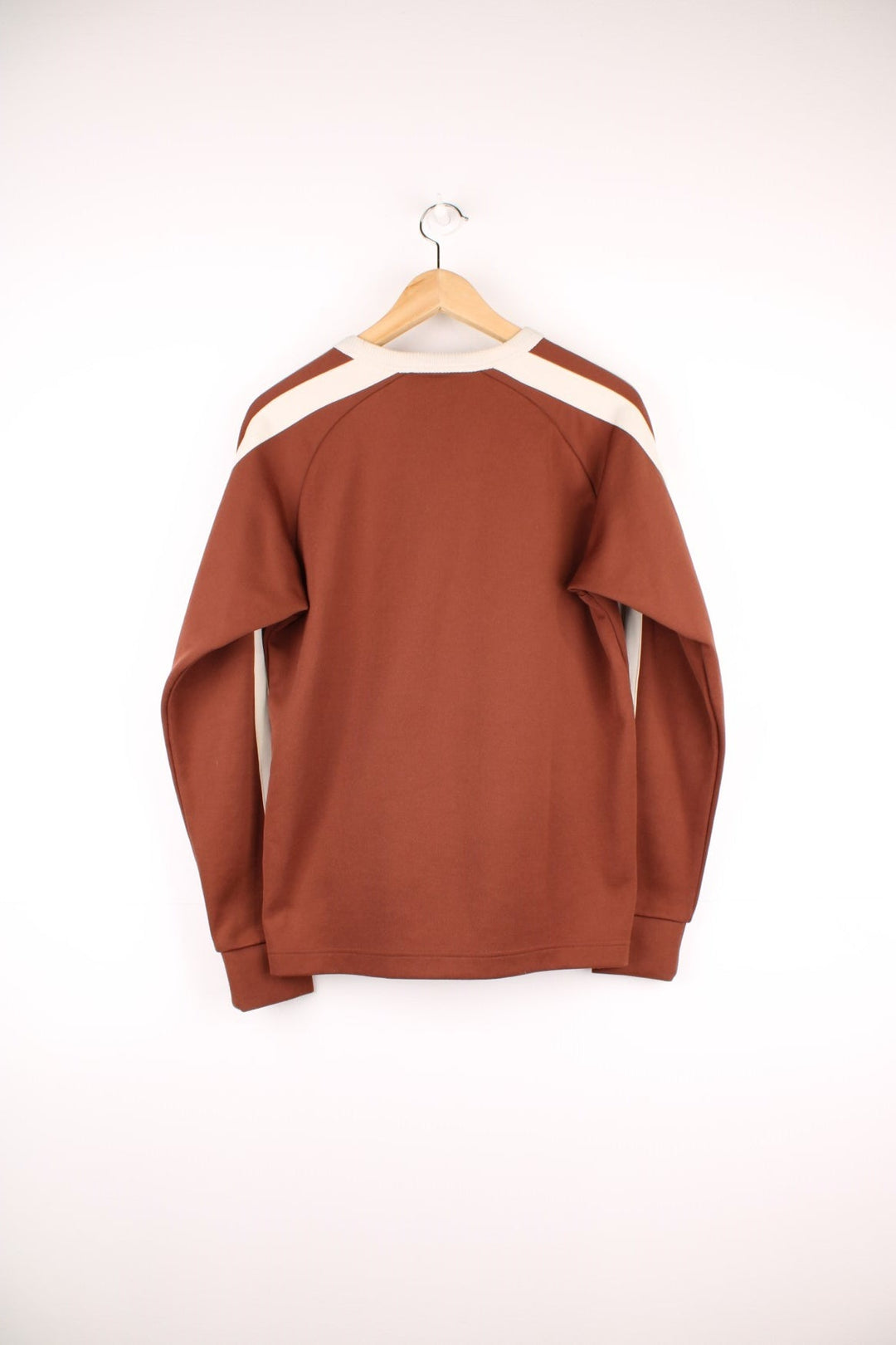 Puma Sweatshirt in brown and beige colourway with stripes going down the sleeves and the logo printed on the chest.