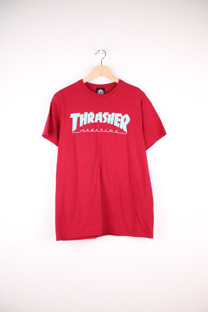 Thrasher Magazine T-Shirt in a in a red colourway with the spell out logo printed across the front in blue and white. 