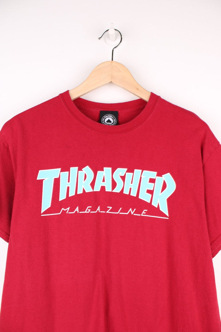 Thrasher Magazine T-Shirt in a in a red colourway with the spell out logo printed across the front in blue and white. 