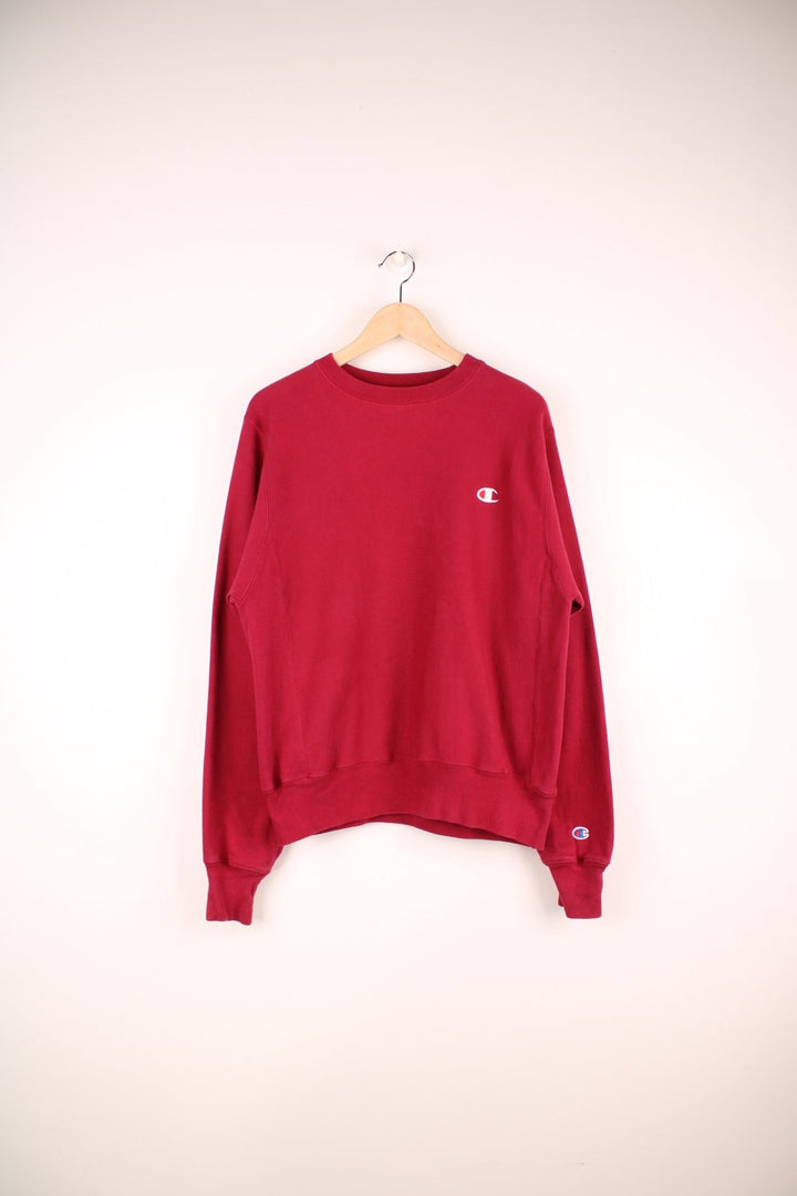 Champion Reverse Weave Sweatshirt in a burgundy red colourway with the logo embroidered on the chest. 