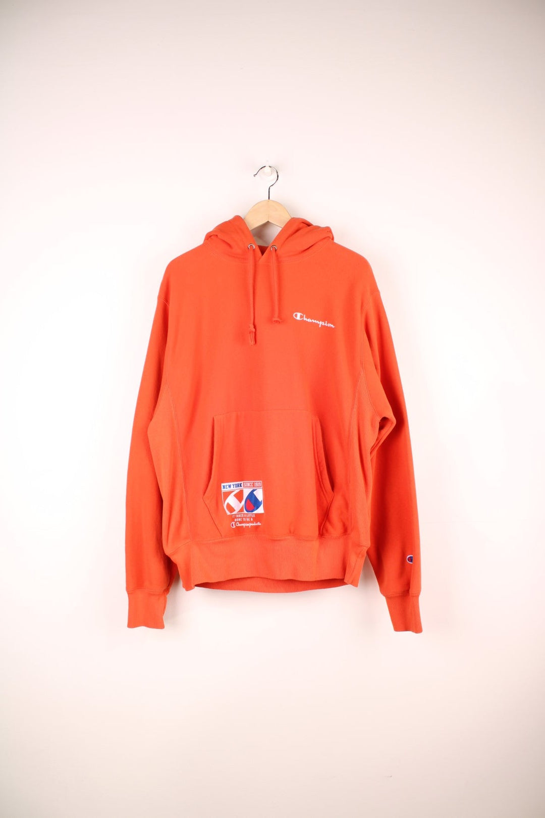 Champion Reverse Weave New York since 1919 Hoodie with embroidered spell out logo on the chest.