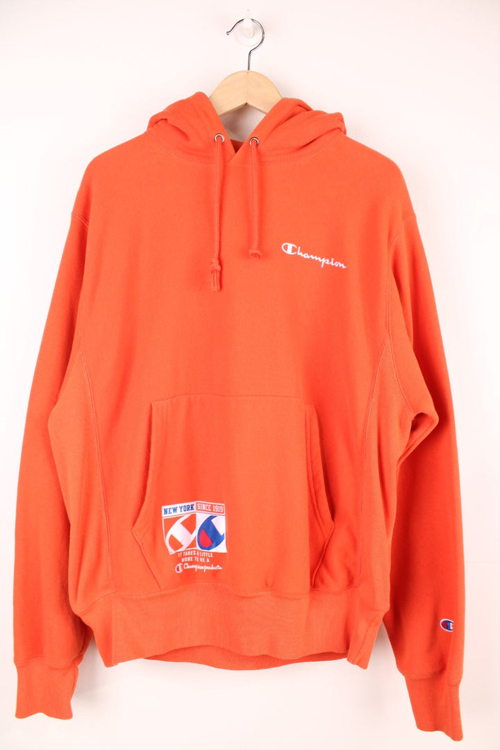 Champion Reverse Weave New York since 1919 Hoodie with embroidered spell out logo on the chest.