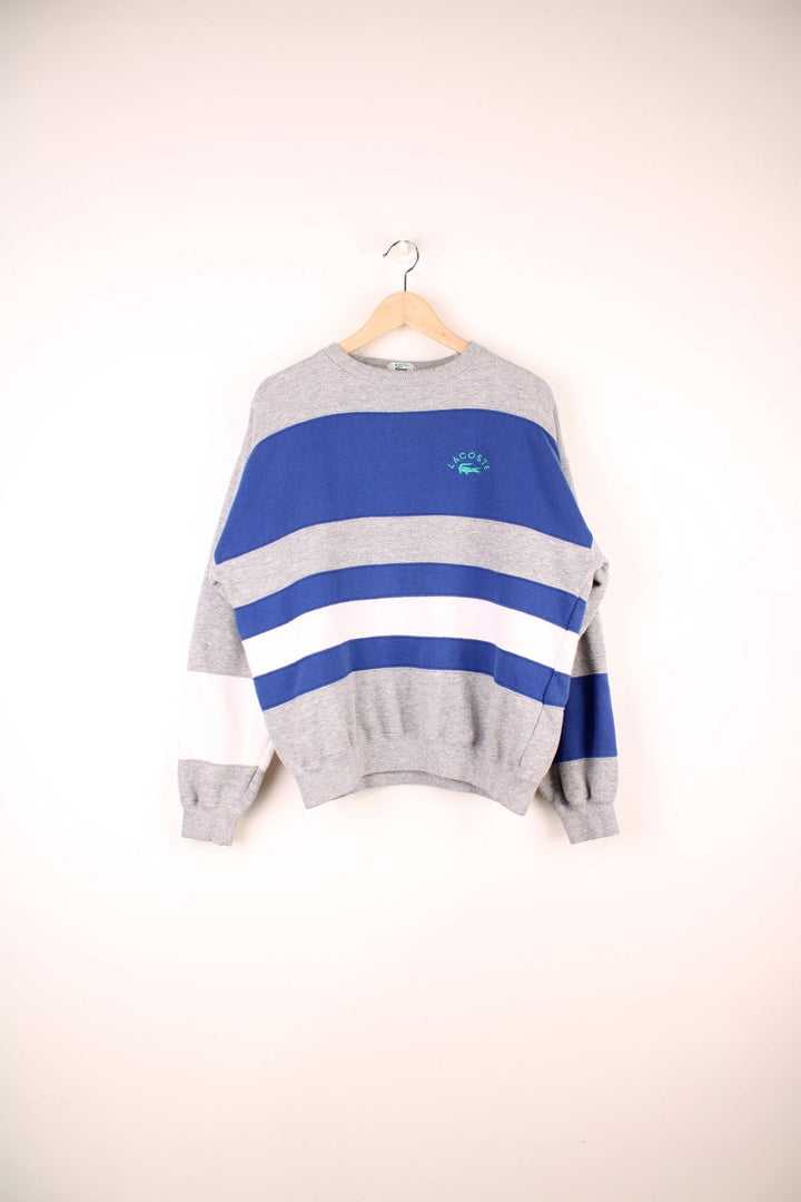 Vintage Izod Lacoste Sweatshirt in a grey, white and blue striped colourway with the logo embroidered on the chest.