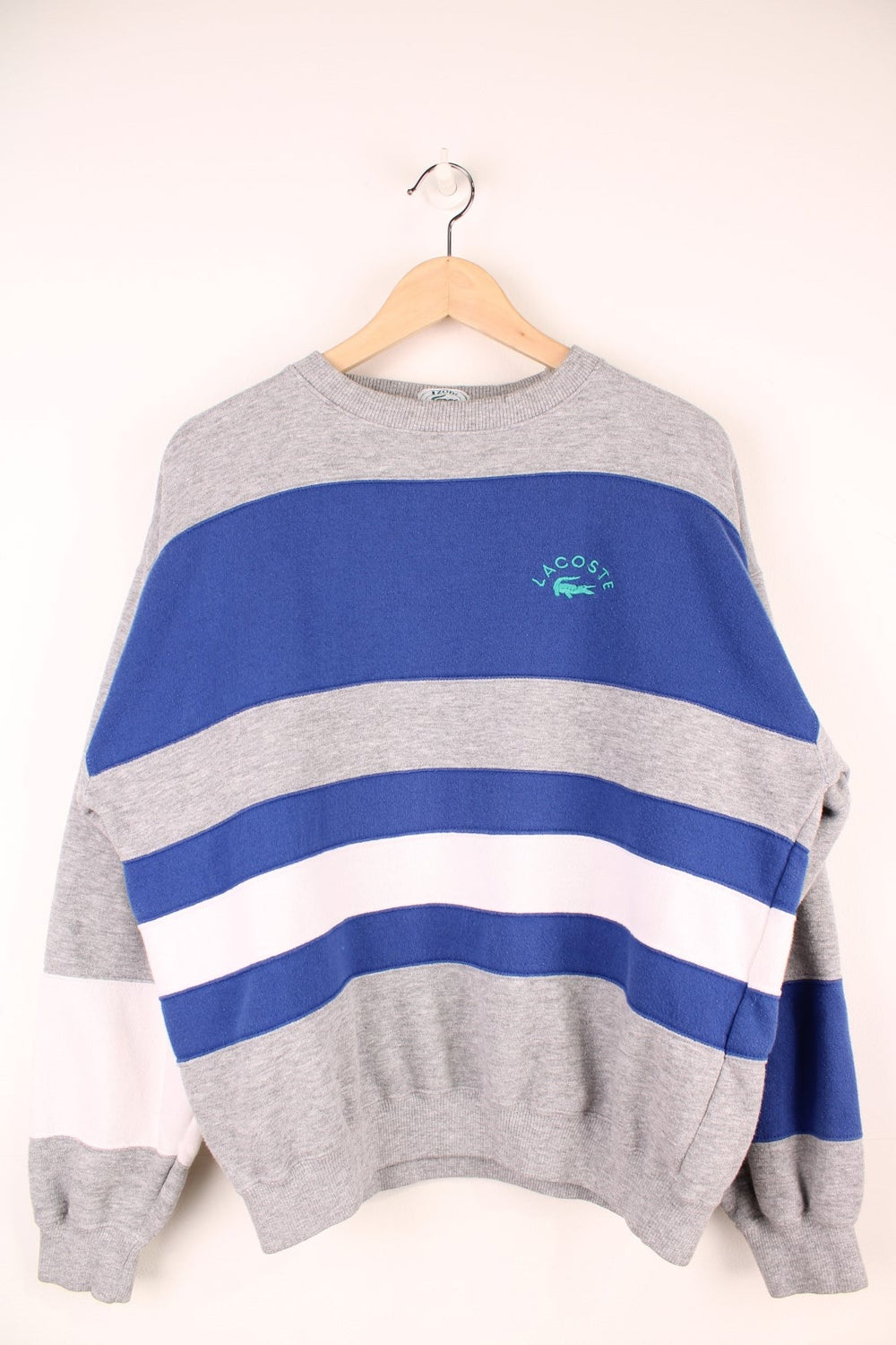 Vintage Izod Lacoste Sweatshirt in a grey, white and blue striped colourway with the logo embroidered on the chest.