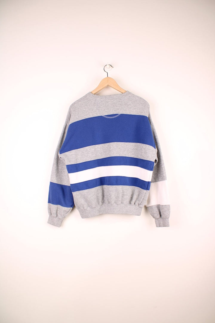 Vintage Izod Lacoste Sweatshirt in a grey, white and blue striped colourway with the logo embroidered on the chest.