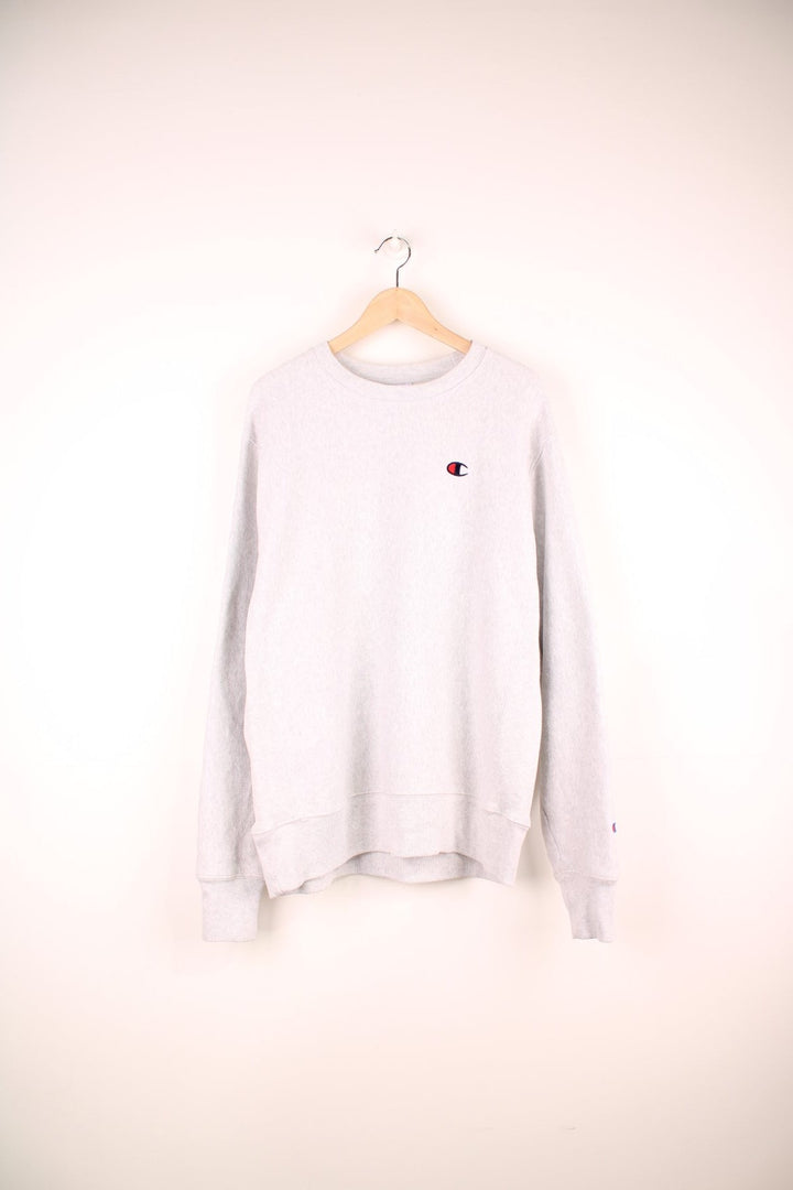 Champion Reverse Weave Sweatshirt in a grey colourway with the logo embroidered on the chest and left sleeve. 