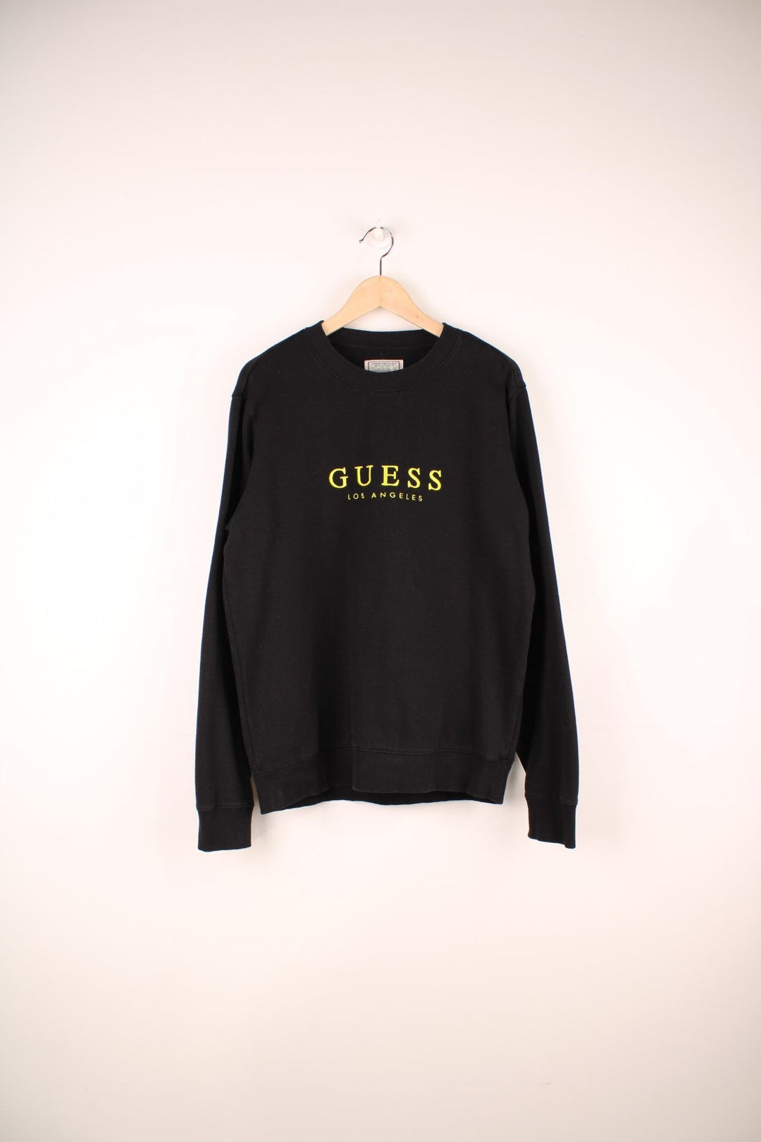 Guess Los Angeles Sweatshirt in black colourway with the spell out logo embroidered across the front. 