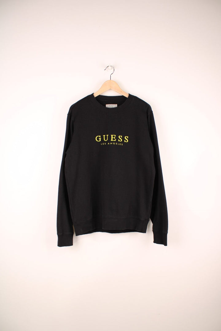 Guess Los Angeles Sweatshirt in black colourway with the spell out logo embroidered across the front. 