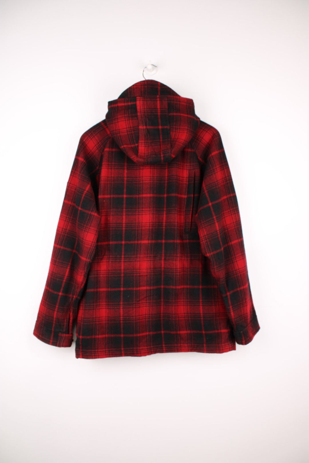 Penfield Trailwear Flannel Jacket in a red and black plaid colourway, zip up with multiple pockets, has a nylon lining, hooded and has the logo embroidered on the front. 