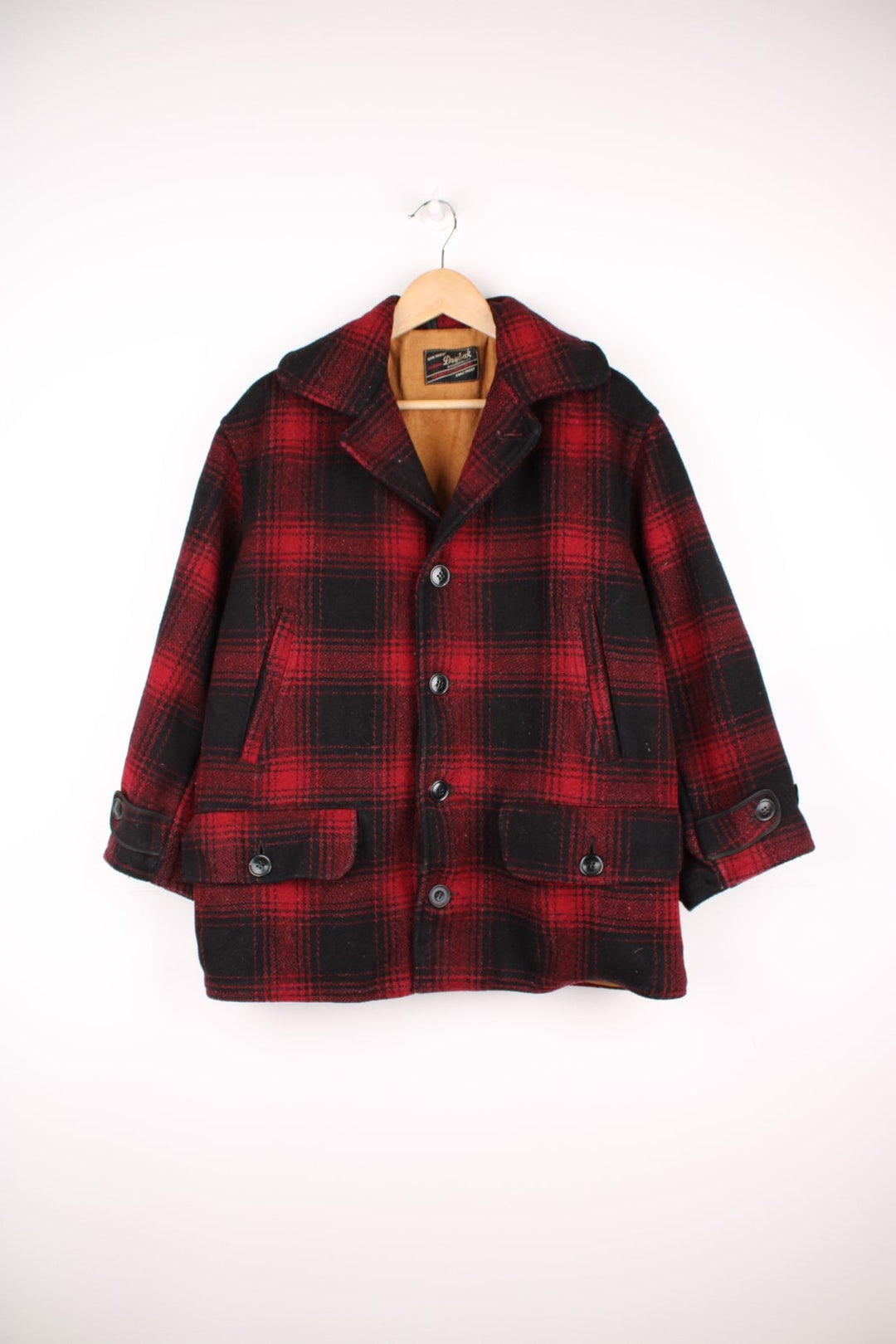 Vintage 1950's Drybak Plaid Flannel Jacket in a red and black colourway, button up with a camp collar, and has multiple pockets. 