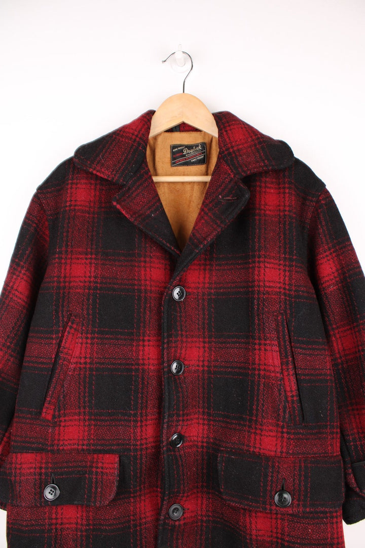 Vintage 1950's Drybak Plaid Flannel Jacket in a red and black colourway, button up with a camp collar, and has multiple pockets. 