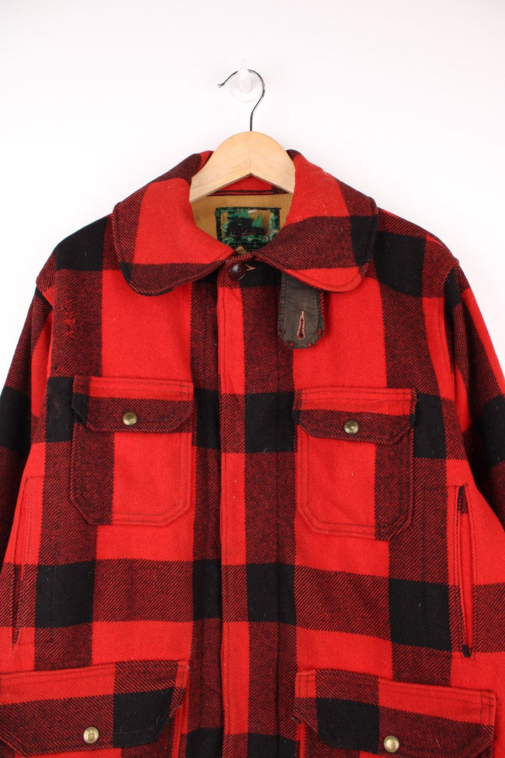 Vintage Woolrich Plaid Wool Coat in a red and black colourway, button up with a big collar and has multiple pockets.