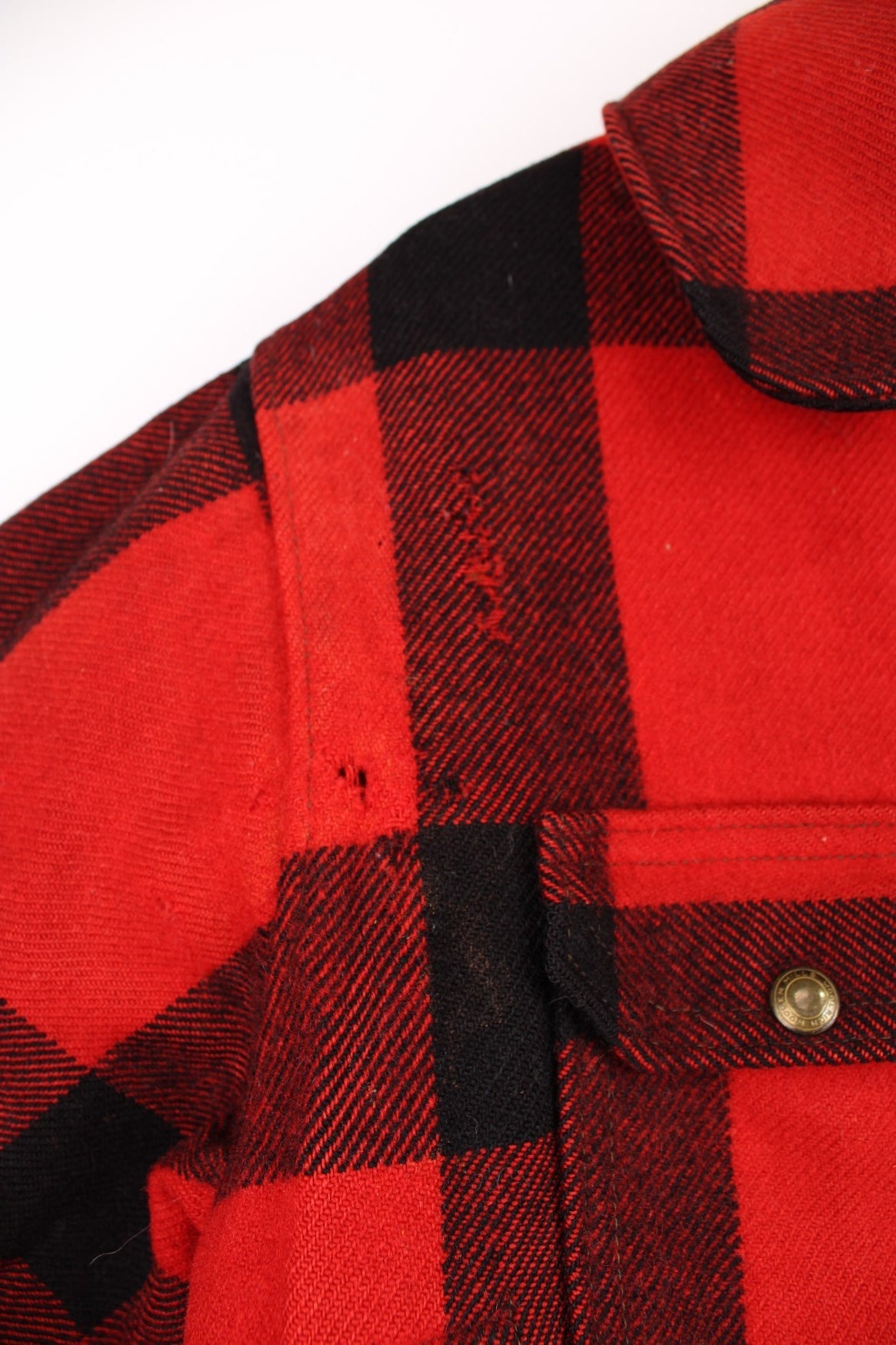 Vintage Woolrich Plaid Wool Coat in a red and black colourway, button up with a big collar and has multiple pockets.