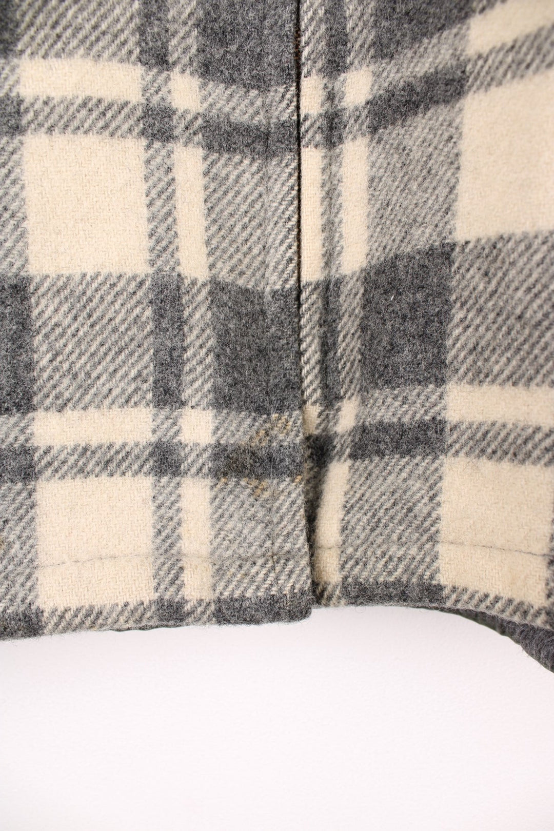 Woolrich Plaid Wool Jacket in a grey and white colourway, zip up with side pockets, and has a sherpa lining. 