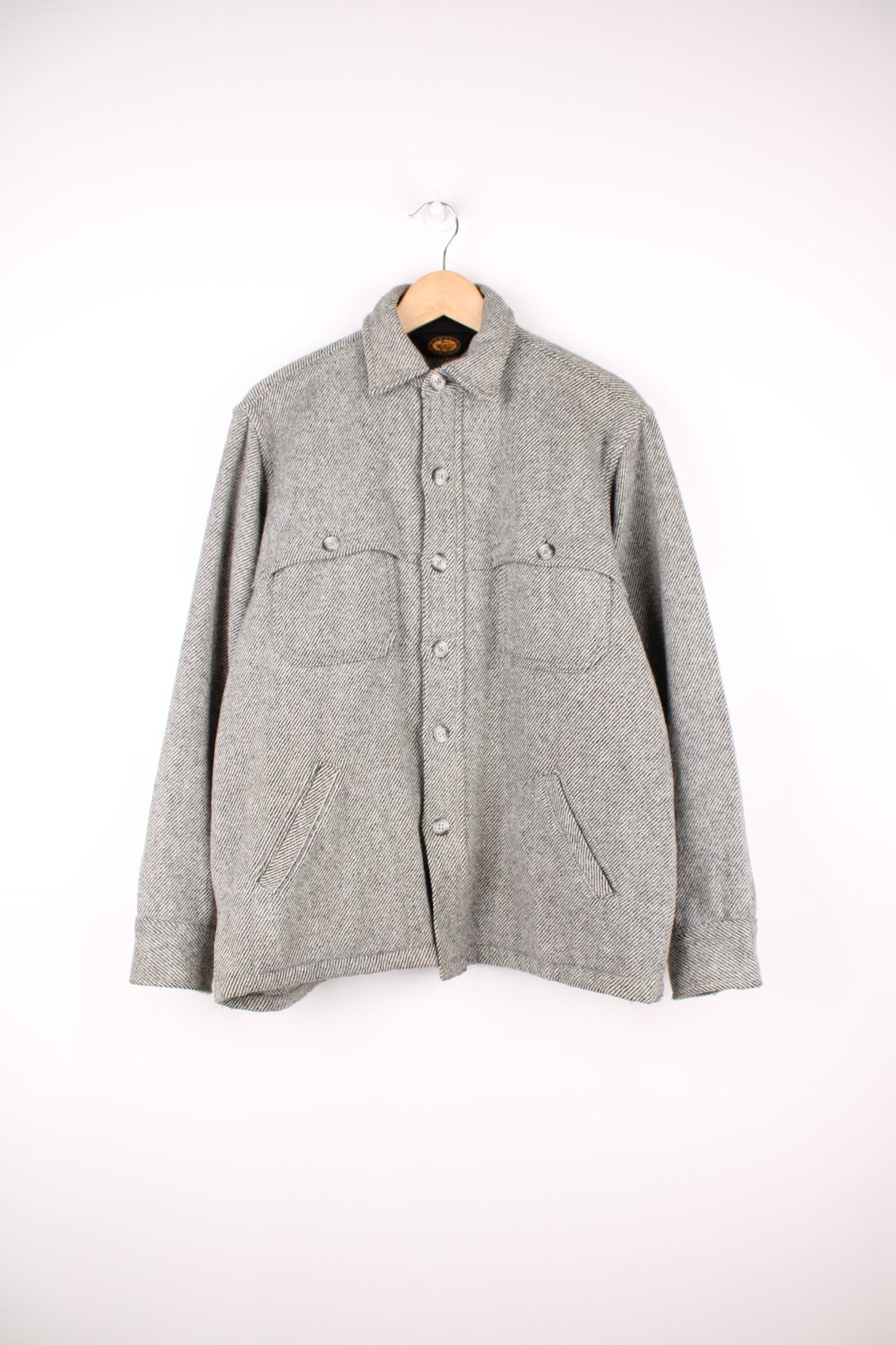 Woolrich Buffalo Tweed Cruiser Shirt Jacket in a grey and black patterned colourway, button up and has multiple pockets. 