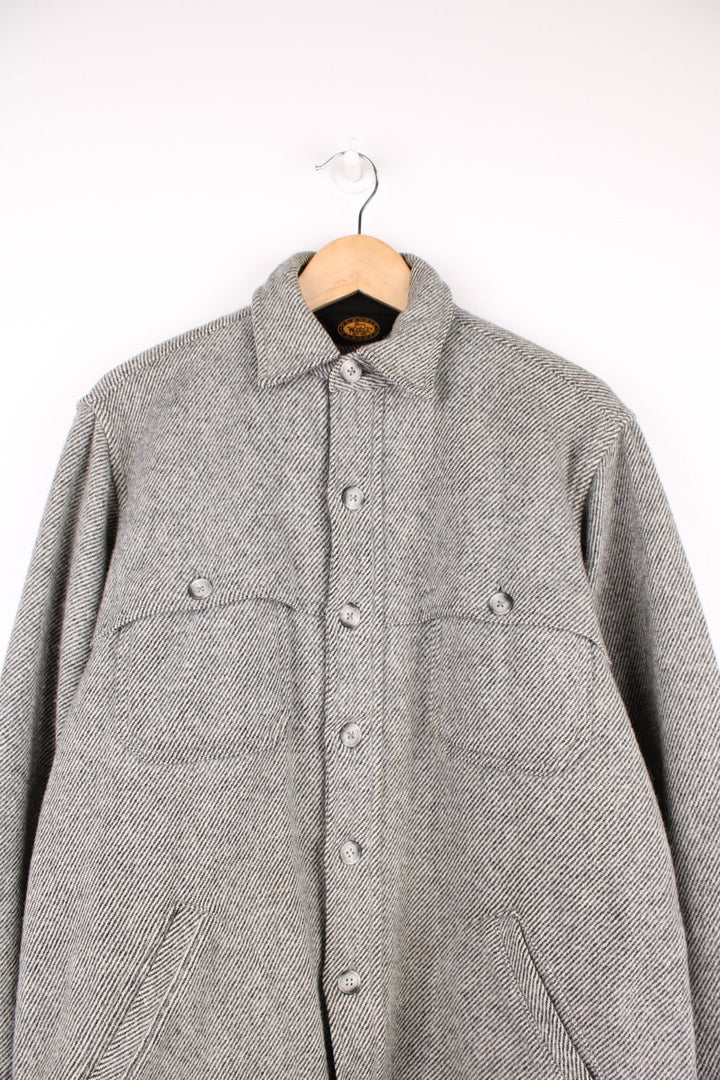 Woolrich Buffalo Tweed Cruiser Shirt Jacket in a grey and black patterned colourway, button up and has multiple pockets. 