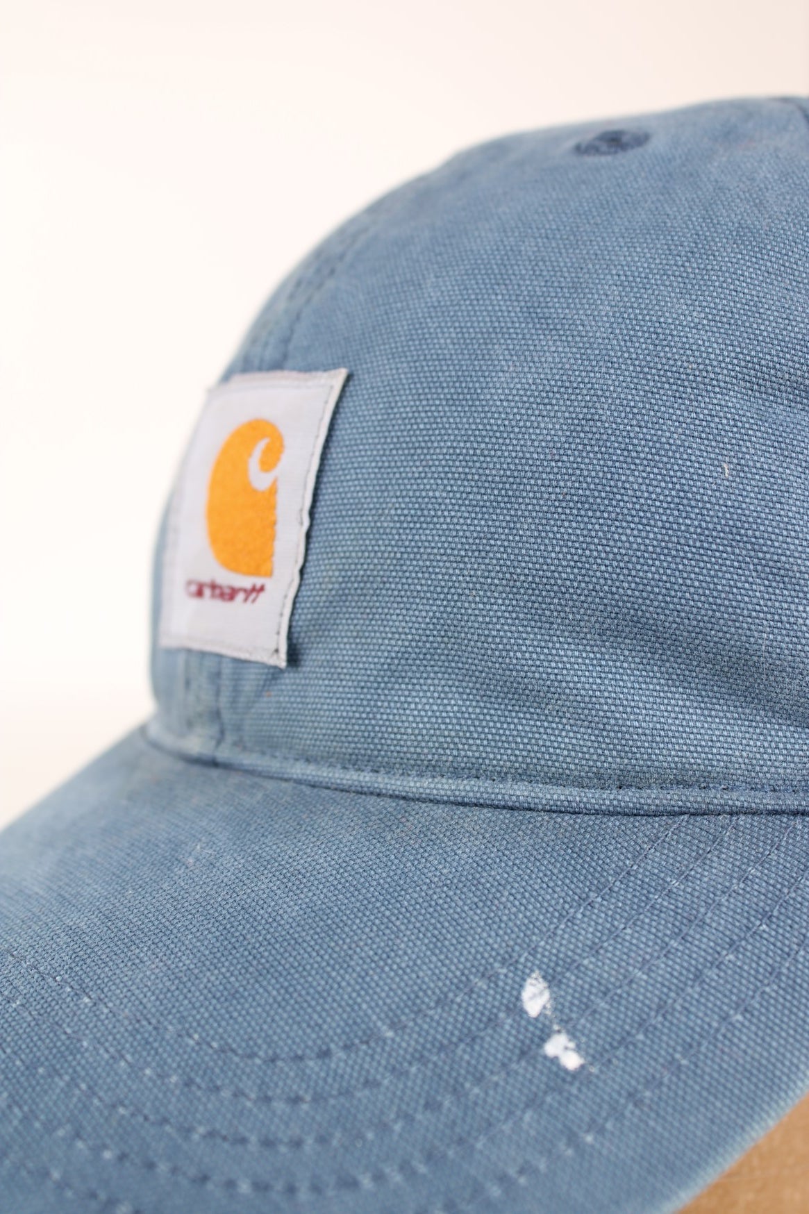 Carhartt Mesh Trucker Cap in a blue colourway with the logo embroidered on the front and has a adjustable strap on the back.