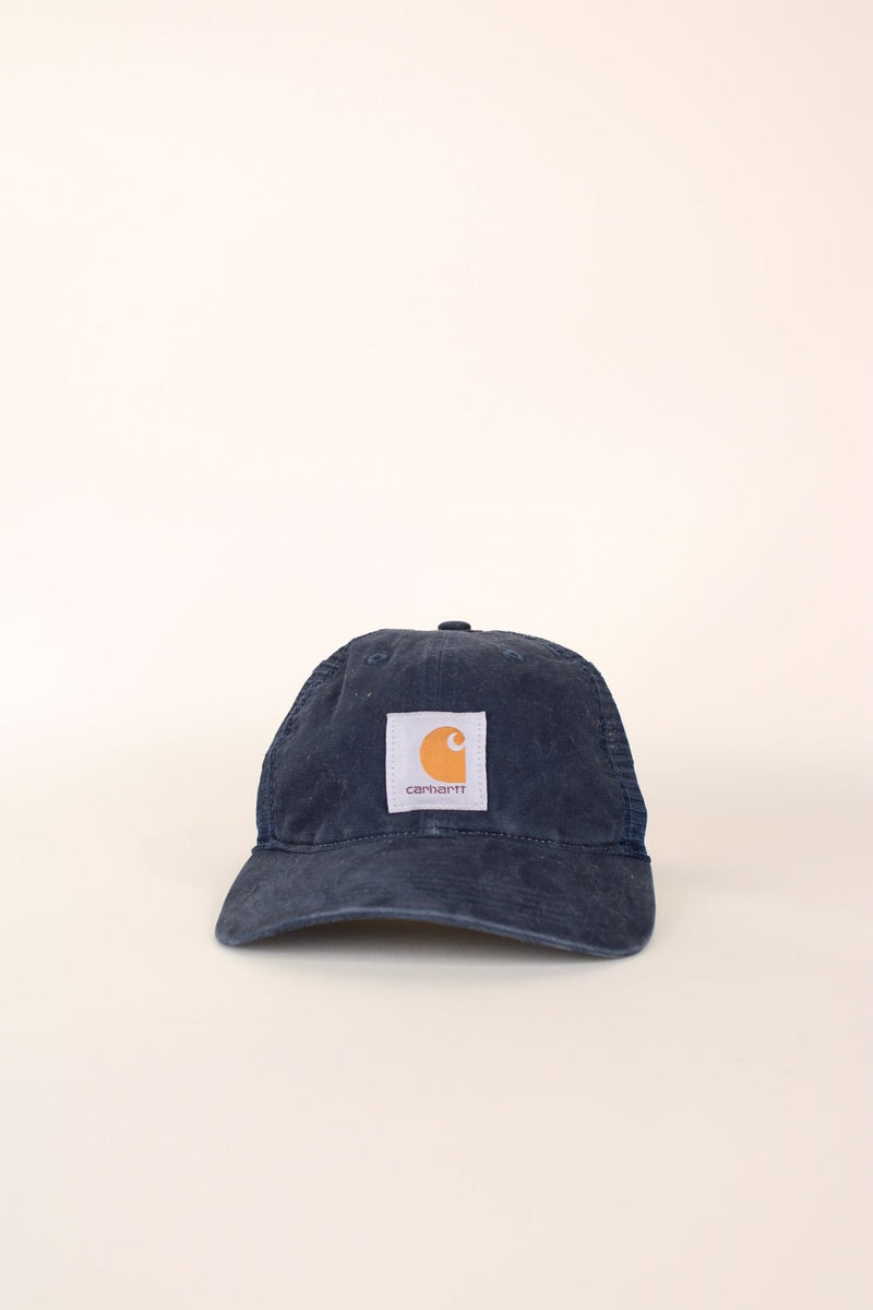 Carhartt Mesh Trucker Cap in a blue colourway with the logo embroidered on the front and has a adjustable strap on the back.