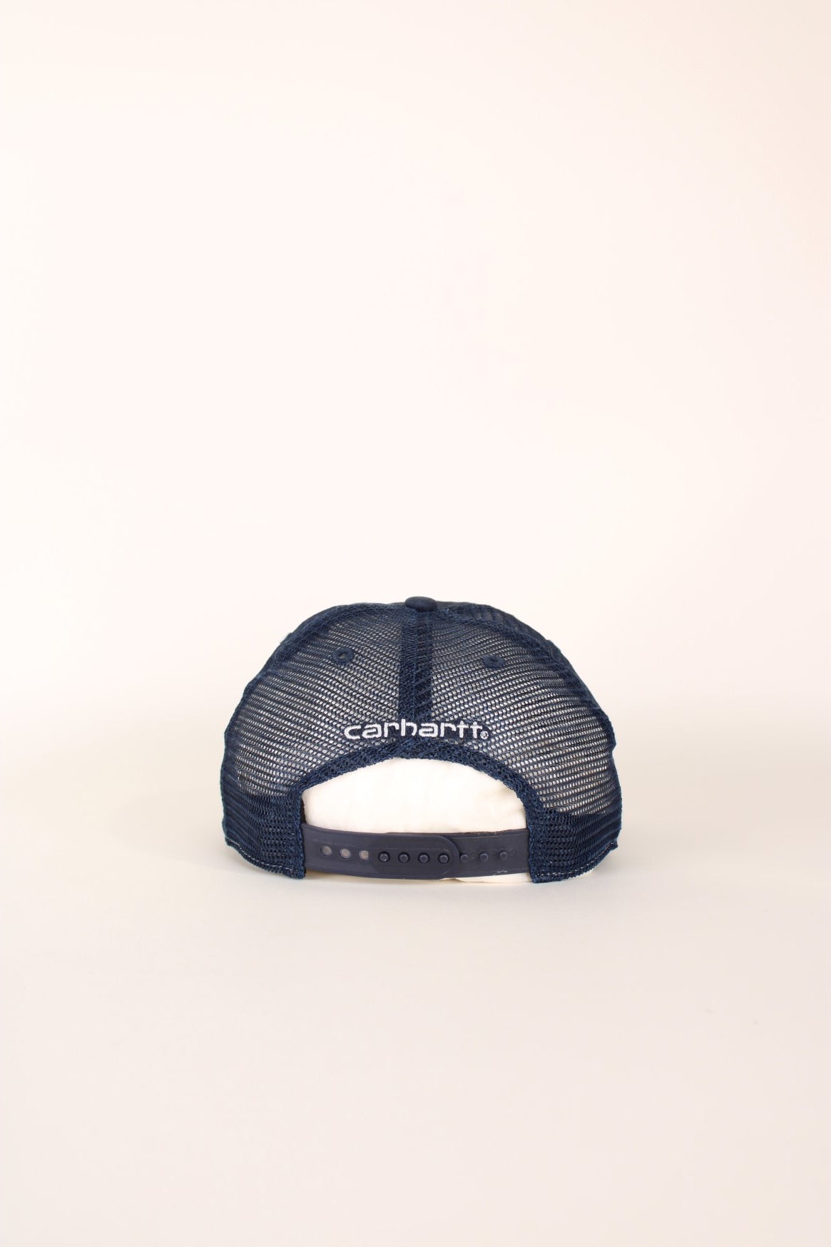 Carhartt Mesh Trucker Cap in a blue colourway with the logo embroidered on the front and has a adjustable strap on the back.